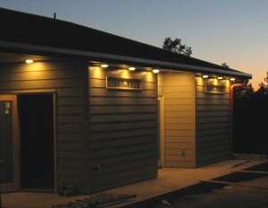 Photo of a house with outdoor lighting